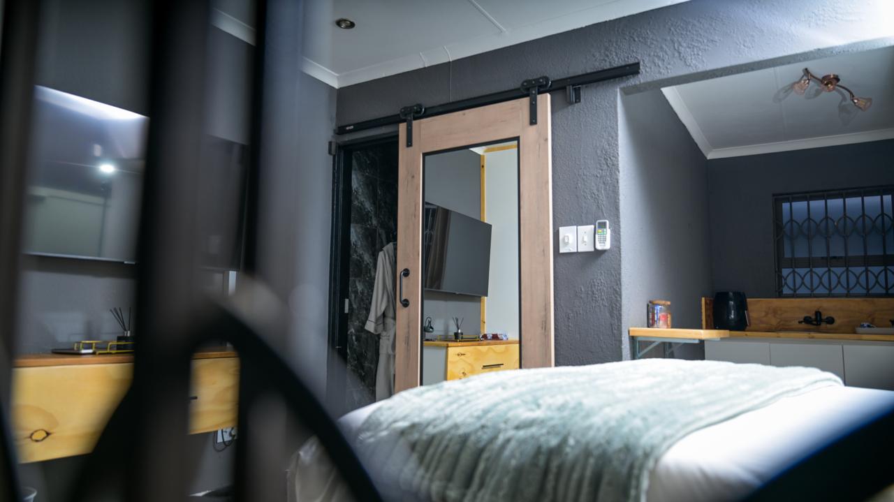 The Bright Room — kitchenette and mirrored barn door