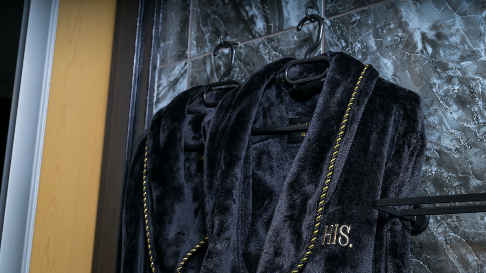 The Dark Room — his and hers bathrobes in the bathroom