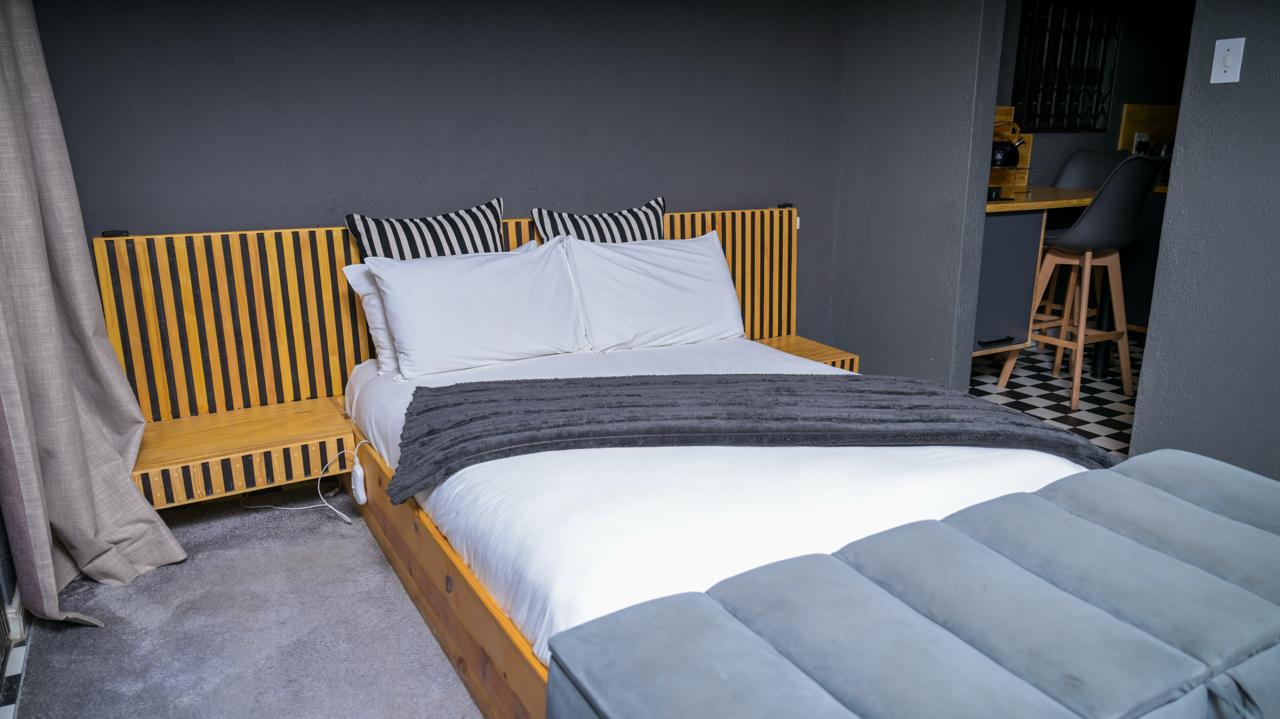 The Dark Room — queen bed with slatted timber headboard