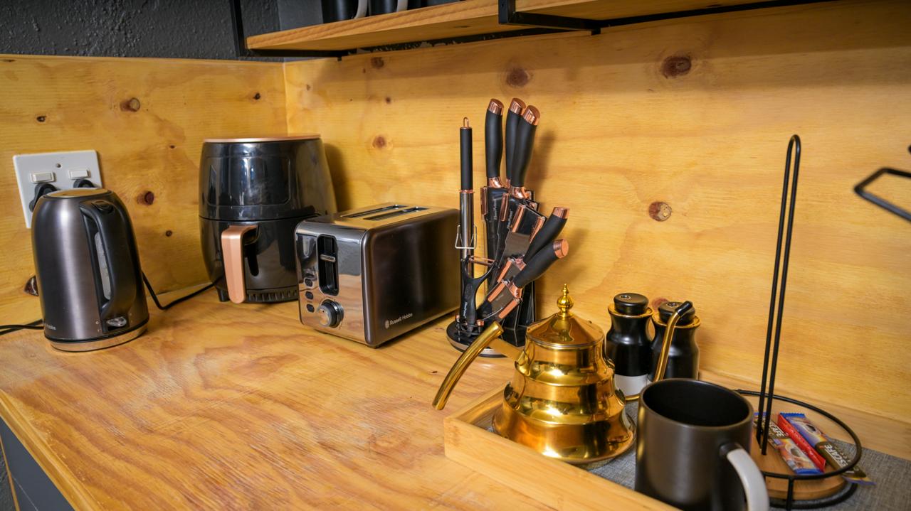 The Dark Room — kitchenette with kettle, air fryer and toaster