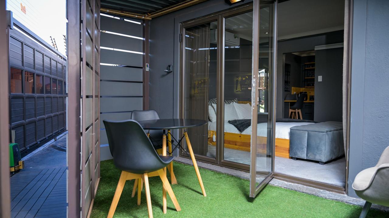 The Dark Room — private entrance seen from the courtyard seating