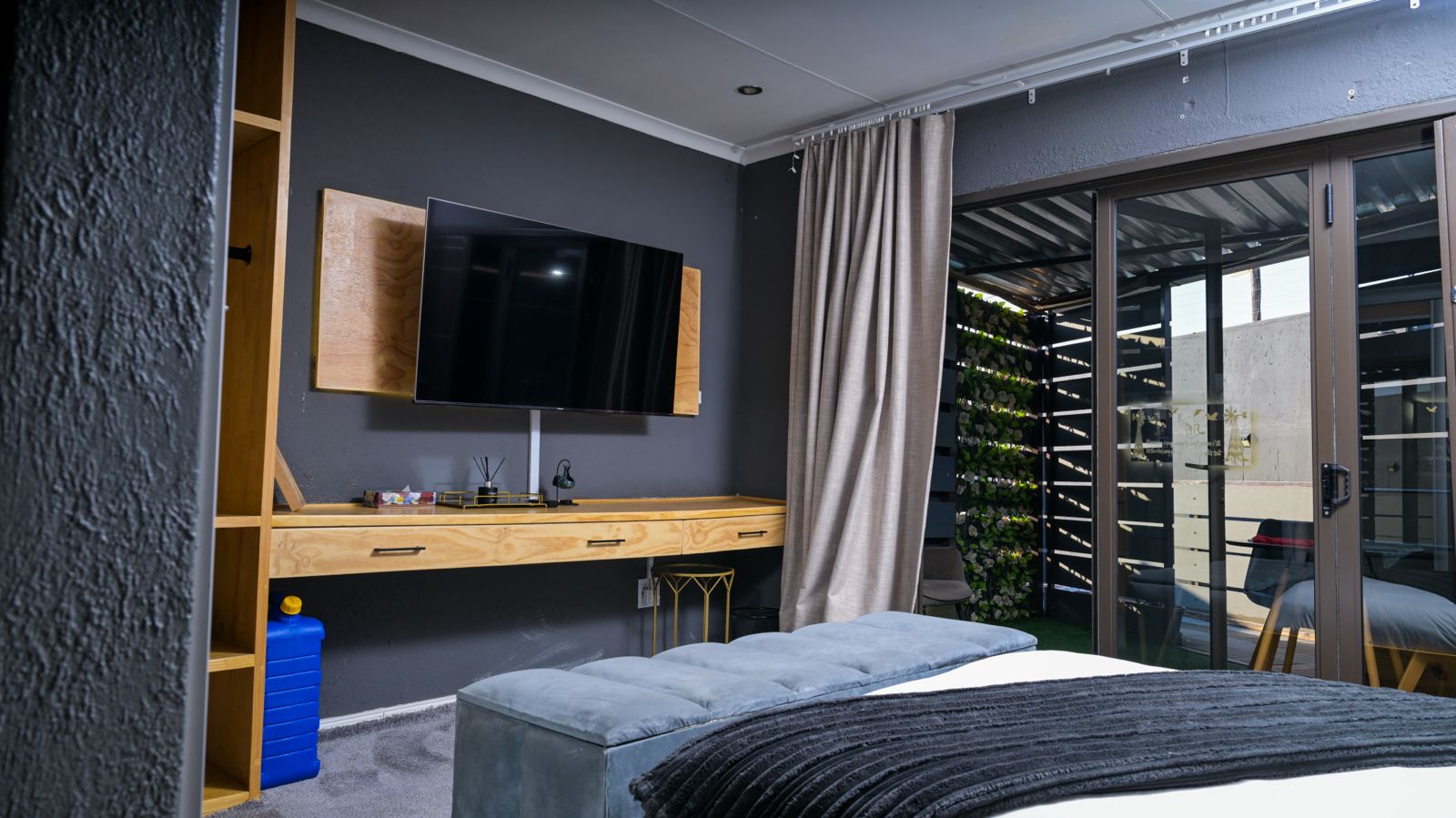 The Dark Room — television, writing desk and private patio doors