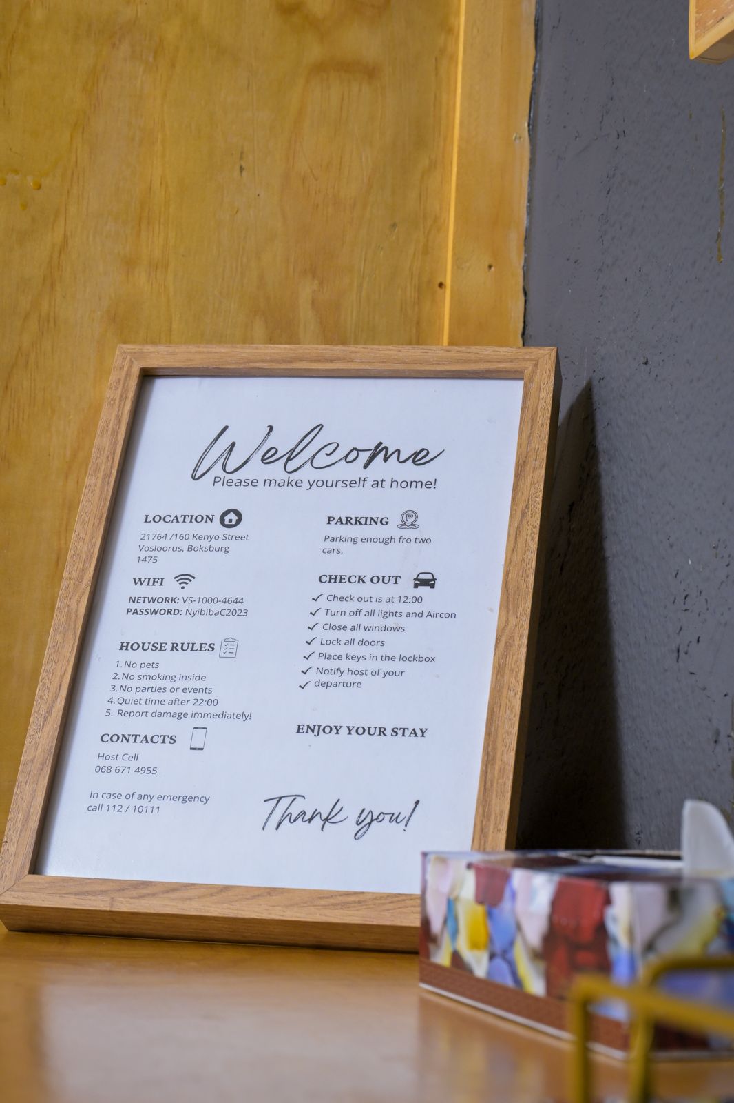 The Dark Room — welcome sign with WiFi and house information