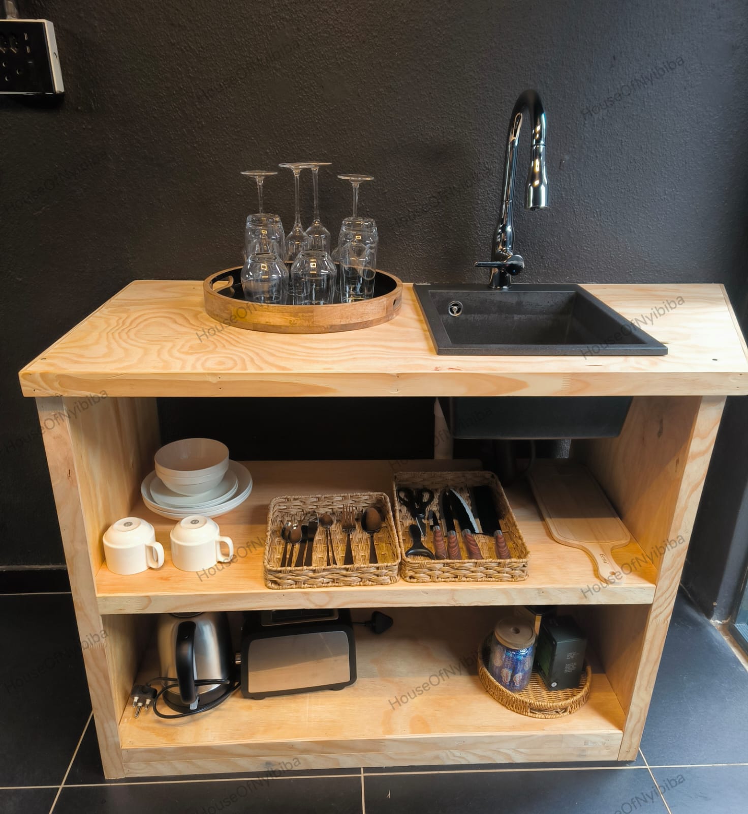 Zululami — kitchenette sink with glassware on a wooden tray
