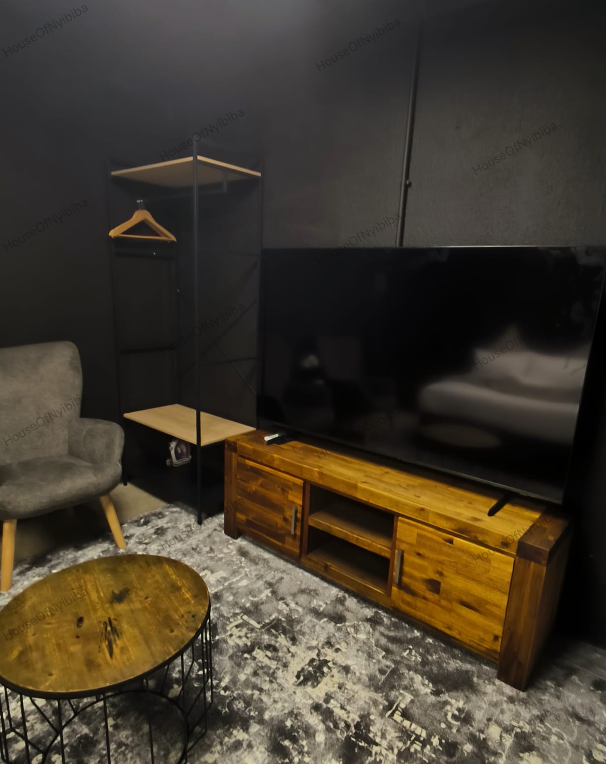 Zululami — flat-screen TV on the wooden media unit