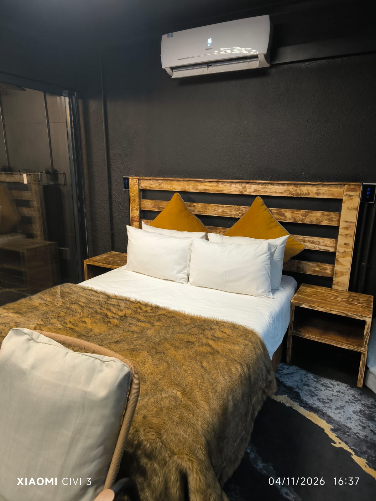 The Mihla Room — crisp white linen and fur throw detail