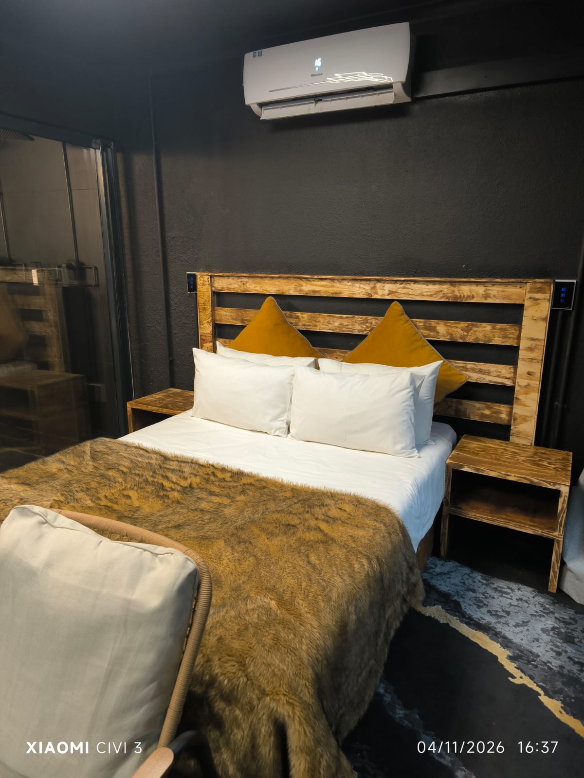 The Mihla Room — queen bed with fur throw and timber headboard
