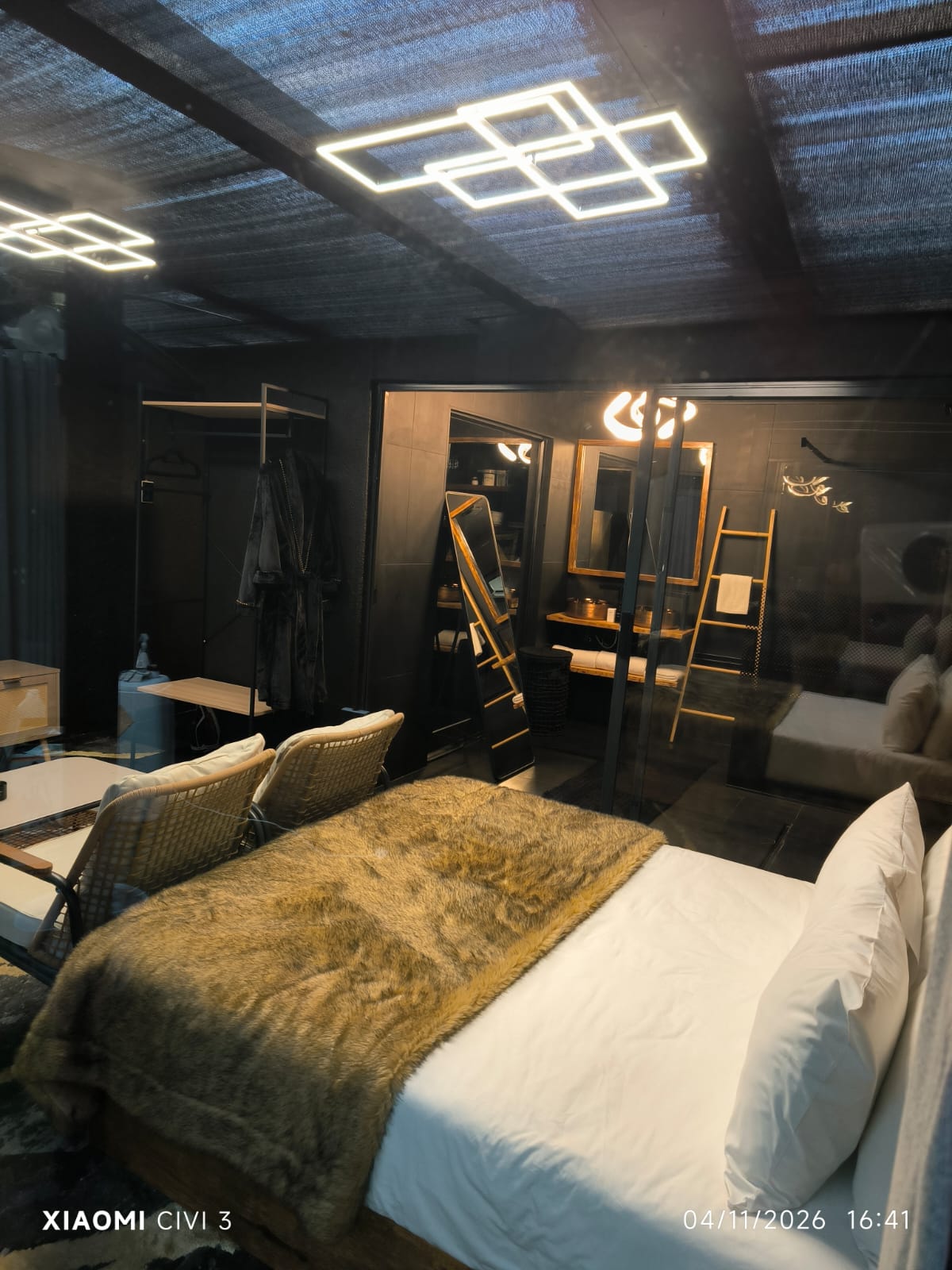 The Mihla Room — evening view from the bed through to the bathroom